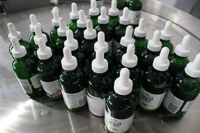 CBD oil dropper bottle labeling machine RELIANCE03